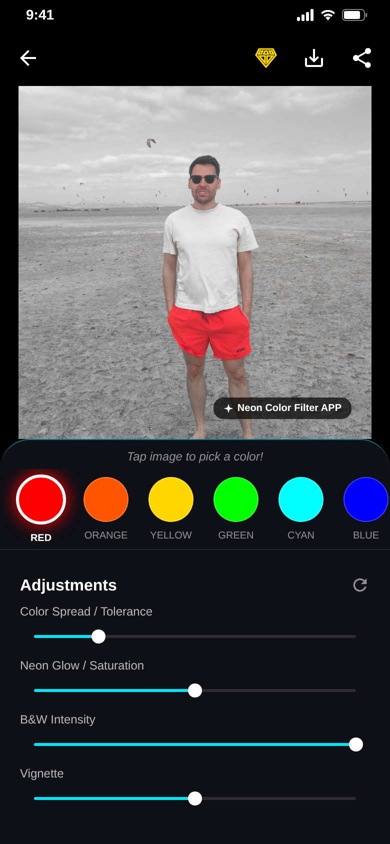 Editor with the red filter: a man on a grey beach, only his red shorts stay in color, sliders for tolerance, glow, B&W and vignette below
